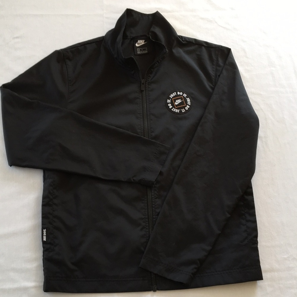 Nike size small mens rain coat.